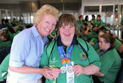 5 July 2011; Team Ireland, sponsored by eircom, returned with 107 medals from the 2011 Special Olympics World Summer Games in Athens. In total 126 athletes from Ireland competed in these prestigious World level Games which took place in Athens from 25th June - 4th July. Pictured as they depart for Dublin Airport are Team Ireland's Team Ireland's Deirdre Gannon, Westport, Co. Mayo and Frances Kavanagh. Athens Airport, Greece. Picture credit: Ray McManus / SPORTSFILE