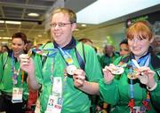5 July 2011; Team Ireland, sponsored by eircom, returned with 107 medals from the 2011 Special Olympics World Summer Games in Athens. In total 126 athletes from Ireland competed in these prestigious World level Games which took place in Athens from 25th June - 4th July. Pictured on their arrival back home at Dublin Airport are Team Ireland's Jonathon Griffin, Ballinasloe, Co. Galway  and Joyce Haughian, Newry, Co. Down. Dublin Airport, Dublin. Picture credit: Ray McManus / SPORTSFILE
