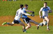 8 February 2017; Jack McCaffrey of UCD with a goal bound shot despite the attention of Ryan McHugh of Ulster University during the Independent.ie HE GAA Sigerson Cup Quarter-Final match between Ulster University and UCD at Jordanstown in Belfast. Photo by Oliver McVeigh/Sportsfile