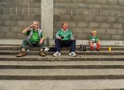 9 July 2011; Limerick supporters, from left, Michael Ryan, Mike Mulcahy and four year old John Ryan-Mulcahy, all from Oola, Co. Limerick, enjoy a cup of tea before the game. GAA Hurling All-Ireland Senior Championship Phase 3, Antrim v Limerick, Parnell Park, Dublin. Picture credit: Ray McManus / SPORTSFILE