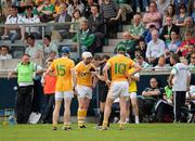 9 July 2011; Karl Stewart, 11, Antrim is booked before being shown a red card by referee James Owens. GAA Hurling All-Ireland Senior Championship Phase 3, Antrim v Limerick, Parnell Park, Dublin. Picture credit: Ray McManus / SPORTSFILE