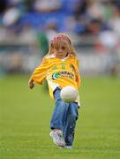 9 July 2011; Antrim supporter Grace Prenter, aged 4, from Rathfarnham, Dublin, kicks a ball around during half-time. Her father Eamonn played for Antrim in the 1980s. GAA Hurling All-Ireland Senior Championship Phase 3, Antrim v Limerick, Parnell Park, Dublin. Picture credit: Ray McManus / SPORTSFILE