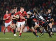 10 February 2017; Rory Scannell of Munster is tackled by Ollie Griffiths and Carl Meyer, 15, of Newport Gwent Dragons during the Guinness PRO12 Round 14 match between Munster and Newport Gwent Dragons at Irish Independent Park in Cork. Photo by Eóin Noonan/Sportsfile