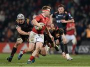 10 February 2017; Rory Scannell of Munster is tackled by Ollie Griffiths, left, and Carl Meyer, right, of Newport Gwent Dragons during the Guinness PRO12 Round 14 match between Munster and Newport Gwent Dragons at Irish Independent Park in Cork. Photo by Eóin Noonan/Sportsfile