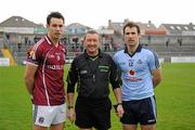10 April 2011; Galway captain Finian Hanley, left, and Dublin captain Bryan Cullen, right, with referee Pat Fox before the game. Allianz Football League, Division 1, Round 7, Galway v Dublin, Pearse Stadium, Salthill, Galway. Picture credit: Ray McManus / SPORTSFILE