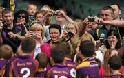 11 July 2011; Parents, guardians and club mates from the Wolf Tones GAA club photograph their players on the presentation podium after competing in the the Leinster GAA Croke Park Activity Day. Croke Park, Dublin. Picture credit: Ray McManus / SPORTSFILE