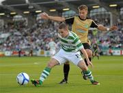 12 July 2011; Dean Kelly, Shamrock Rovers, in action against Sergei Mosnikov, Flora Tallinn. UEFA Champions League Second Qualifying Round, 1st leg, Shamrock Rovers v Flora Tallinn, Tallaght Stadium, Tallaght, Dublin. Photo by Sportsfile