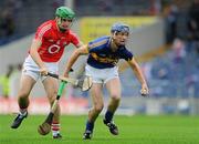 15 July 2011; Brian Stapleton, Tipperary, in action against William Egan, Cork. Bord Gáis Energy Munster GAA Hurling Under 21 Championship Semi-Final, Tipperary v Cork, Semple Stadium, Thurles, Co. Tipperary. Picture credit: Brian Lawless / SPORTSFILE