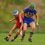 16 July 2011; Jennifer O'Leary, Cork, in action against Cora Hennessy, Tipperary. All-Ireland Senior Camogie Championship in association with RTE Sport, Cork v Tipperary, Cork Institute of Technology, Bishopstown, Cork. Picture credit: Barry Cregg / SPORTSFILE