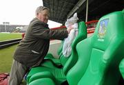 16 July 2011; Chief steward John Naughton cleans the rain from the substitutes seats before the game. GAA Football All-Ireland Senior Championship Qualifier, Round 3, Limerick v Waterford, Gaelic Grounds, Limerick. Picture credit: Diarmuid Greene / SPORTSFILE
