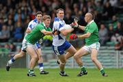 16 July 2011; Gary Hurney, Waterford, in action against Johnny McCarthy, left, and Stephen Lavin, Limerick. GAA Football All-Ireland Senior Championship Qualifier, Round 3, Limerick v Waterford, Gaelic Grounds, Limerick. Picture credit: Diarmuid Greene / SPORTSFILE