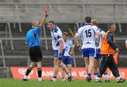 16 July 2011; Gary Hurney, Waterford, is shown a red card by referee Cormac Reilly. GAA Football All-Ireland Senior Championship Qualifier, Round 3, Limerick v Waterford, Gaelic Grounds, Limerick. Picture credit: Diarmuid Greene / SPORTSFILE