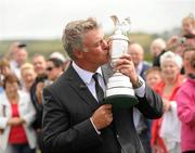 19 July 2011; Golfer Darren Clarke kisses the Golf Champion Trophy, Claret Jug, after a press conference, following his victory at the weekend in the Open Championship at Royal St George's. Royal Portrush Golf Club, Dunluce Rd, Portrush, Co. Antrim. Picture credit: Oliver McVeigh / SPORTSFILE