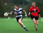 19 February 2002; Elaine Murphy of UCD is tackled by Meadbh De Nais of UCC during the Higher Education League Ladies Football Final between UCD and UCC at Donnybrook in Dublin. Photo by Aofie Rice/Sportsfile