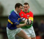 3 March 2002; Benny Hickey of Tipperary in action against Andrew Corden of Carlow during the Allianz National Football League Division 2B Round 4 match between Carlow and Tipperary at Dr Cullen Park in Carlow. Photo by Aoife Rice/Sportsfile