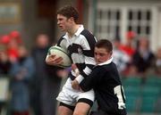 4 March 2002; Marc Hewitt of Belvedere College is tackled by Fergal Lawlor of Cistercian College Roscrea during the Leinster Schools Senior Cup Semi-Final match between Belvedere College and Cistercian College Roscrea at Lansdowne Road in Dublin. Photo by Damien Eagers/Sportsfile