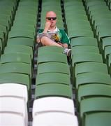 7 June 2013; A Republic of Ireland supporter eats chips while reading the programme ahead of the 2014 FIFA World Cup Qualifier Group C match between Republic of Ireland and Faroe Islands at the Aviva Stadium in Dublin. Photo by Brian Lawless/Sportsfile