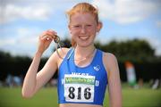 23 July 2011; Kate Veale, West Waterford A.C., Co. Waterford holds up her gold medal after winning the U-18 Girl's 3000m Walk, where she set a new national record time of 12:18.86, during the Woodie's DIY Juvenile Track and Field Championships of Ireland, Tullamore Harriers, Tullamore, Co. Offaly. Picture credit: Barry Cregg / SPORTSFILE