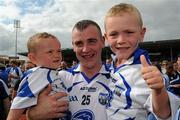 24 July 2011; Eoin Kelly celebrates the Waterford victory with his two sons, Fonn, left, 15 months, and Séan, five years. GAA Hurling All-Ireland Senior Championship Quarter Final, Waterford v Galway, Semple Stadium, Thurles, Co. Tipperary. Picture credit: Ray McManus / SPORTSFILE