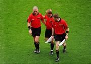 31 July 2011; Referee Pat McEnaney, left, leaves the pitch with linesmen Eddie Kinsella and Pádraig Hughes, right. GAA Football All-Ireland Senior Championship Quarter-Final, Kerry v Limerick, Croke Park, Dublin. Picture credit: Dáire Brennan / SPORTSFILE