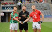 31 July 2011; Referee Rory Hickey tosses the coin as Mayo captain Alan Dillon, left, and Cork captain Michael Shields exchange a handshake before the game. GAA Football All-Ireland Senior Championship Quarter-Final, Mayo v Cork, Croke Park, Dublin. Picture credit: Diarmuid Greene / SPORTSFILE