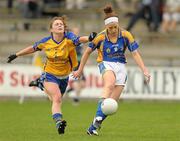 1 August 2011; Gillian O'Brien, Tipperary, in action against Louise Woods, Clare. TG4 Ladies Football Senior Championship – Round 1 Qualifier, Clare v Tipperary, Birr, Co. Offaly. Photo by Sportsfile