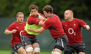 4 August 2011; Ireland's Kevin McLaughlin is tackled by Donnacha Ryan, watched by Sean Cronin and Tom Court, during rugby squad training ahead of their upcoming World Cup warm-up game against Scotland on Saturday next. Ireland Rugby Squad Training, Carton House, Maynooth, Co. Kildare. Picture credit: Brendan Moran / SPORTSFI