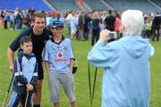 5 August 2011; Declan Murphy, age 7, from Santry, Dublin, and Ben Thornton, age 12, from Dundrum, Dublin, have their picture taken by granny Doherty Murphy, from Beaumount, Dublin, with Dublin player Shane Durkin during an open training session ahead of his side's GAA Hurling All-Ireland Senior Championship Semi-Final match against Tipperary, on August 14th. Dublin Hurling Squad Press Evening, Parnell Park, Dublin. Picture credit: Stephen McCarthy / SPORTSFILE