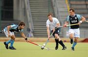 7 August 2011; John Jackson, Ireland, in action against Juan Lopez, left, and Lucas Vila, Argentina. Men's Hockey International, Ireland v Argentina. National Hockey Stadium, UCD, Belfield, Dublin. Picture credit: Barry Cregg / SPORTSFILE