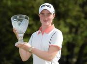 7 August 2011; Leona Maguire, Ireland, on the 18th green with her trophy after finishing as the leading amateur  at the Ladies Irish Open Golf Championship. Killeen Castle, Dunsany, Co. Meath. Picture credit: Matt Browne / SPORTSFILE