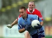 10 March 2002; Paul Curran of Dublin is tackled by Brendan O'Sullivan of Cork during the Allianz National Football League Division 1A Round 4 match between Cork and Dublin at Pairc Ui Chaoimh in Cork. Photo by Brendan Moran/Sportsfile