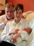 13 March 2002; Irish athlete Catherina McKiernan and her husband Damien O'Reilly with their new baby daughter Deirbhile at their home in Dublin. Photo by Brendan Moran/Sportsfile