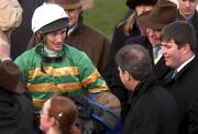 13 March 2002;  TJ McNamara pictured with J.P. McManus after winning the 132nd Year of The National Hunt Steeple Chase Challenge Cup during Day Two of the Cheltenham Racing Festival at Prestbury Park in Cheltenham, England. Photo by Matt Browne/Sportsfile