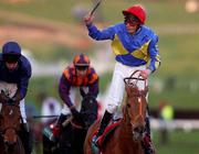13 March 2002; Jamie Spence celebrates after winning The Weatherbys Champion Bumper on Pizarro during Day Two of the Cheltenham Racing Festival at Prestbury Park in Cheltenham, England. Photo by Matt Browne/Sportsfile