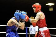 11 August 2011; Eric Donovan, St. Michaels Athy, right, exchanges punches with Gavin Keating, St. Saviours OBA, during their 60kg Quarter-Final bout. IABA Senior Open Elite Competition 2011, National Stadium, Dublin. Picture credit: Brian Lawless / SPORTSFILE