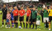 10 August 2011; Croatia team mascot Jade Packinham, alongside captain Darijo Srna and goalkeeper Stipe Pletikosa, with Republic of Ireland team macsot Ronan McRory, alongside captain Robbie Keane and goalkeeper Shay Given, and the match officials, before the start of the game. International Soccer Friendly, Republic of Ireland v Croatia, Aviva Stadium, Lansdowne Road, Dublin. Picture credit: Pat Murphy / SPORTSFILE