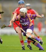 13 August 2011; Karen Atkinson, Wexford, in action against Joanne Casey, Cork. All-Ireland Senior Camogie Championship Semi-Final in association with RTE Sport, Cork v Wexford, Nowlan Park, Kilkenny. Picture credit: Pat Murphy / SPORTSFILE