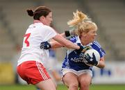 13 August 2011; Martina Dunne, Laois, in action against Lynda Donnelly, Tyrone. TG4 All-Ireland Ladies Senior Football Championship Quarter-Final, Laois v Tyrone, St Brendan's Park, Birr, Co. Offaly. Picture credit: Stephen McCarthy / SPORTSFILE