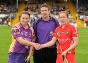 13 August 2011; Ursula Jacob, Wexford, and Rena Buckley, Cork, right, shake hands in front of referee Fintan McNamara. All-Ireland Senior Camogie Championship Semi-Final in association with RTE Sport, Cork v Wexford, Nowlan Park, Kilkenny. Picture credit: Pat Murphy / SPORTSFILE