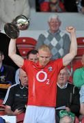 20 August 2011; Cork captain Cáthrach Keane lifts the cup after the game. GAA Football All-Ireland Junior Championship Final, Cork v Kildare, Semple Stadium, Thurles, Co. Tipperary. Picture credit: Barry Cregg / SPORTSFILE