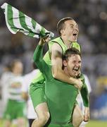 25 August 2011; Gary Twigg, Shamrock Rovers, celebrates by carrying team-mate Gary McCabe after the game. UEFA Europa League Play-off Round Second Leg, Shamrock Rovers v FK Partizan Belgrade, FK Partizan Stadium, Belgrade, Serbia. Picture credit: Srdjan Stevanovic / SPORTSFILE