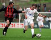 31 March 2002; Owen Heary of Shelbourne in action against Fergal Harkin of Bohemians during the eircom League Premier Division match between Bohemians and Shelbourne at Dalymount Park in Dublin. Photo b Brian Lawless/Sportsfile