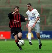 31 March 2002; Owen Heary of Shelbourne in action against Trevor Molloy of Bohemians during the eircom League Premier Division match between Bohemians and Shelbourne at Dalymount Park in Dublin. Photo b Brian Lawless/Sportsfile