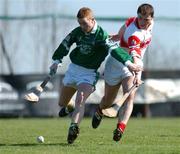 7 April 2002; Paul Carey of Limerick in action against Ronan McCloskey of Derry during the Allianz National Hurling League Division 1B Round 5 match between Derry and Limerick at Erin's Owen GAA in Lavey, Derry. Photo by Ray McManus/Sportsfile