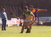 7 April 2002; Hubert Rigney of Offaly in action against Adrian Fenlon of Wexford during the Allianz National Hurling League Division 1B Round 5 match between Offaly and Wexford at St Brendan's Park in Birr, Offaly. Photo by Aoife Rice/Sportsfile