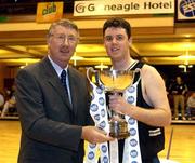 24 March 2002; Ballina captain Paul Barrett is presented with the trophy by Joe Palmer, Deputy President of the IBA, after the ESB Men's National Championships Division 1 Final match between Longnecks Ballina and Neptune at the National Exhibition Centre in Killarney, Kerry. Photo by Brendan Moran/Sportsfile