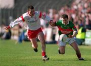 14 April 2002; David Nestor of Mayo in action against Conor Gourley of Tyrone during the Allianz National Football League Division 1 Semi-Final match between Mayo and Tyrone at Brewster Park in Enniskillen, Fermanagh. Photo by Damien Eagers/Sportsfile