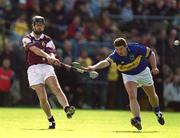 14 April 2002; Richie Murray of Galway in action against John Carroll of Tipperary during the Allianz National Hurling League Quarter-Final match between Galway and Tipperary at Semple Stadium in Thurles, Tipperary. Photo by Brendan Moran/Sportsfile