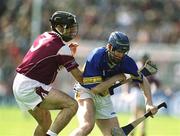 14 April 2002; John O'Brien of Tipperary in action against Michael Healy of Galway during the Allianz National Hurling League Quarter-Final match between Galway and Tipperary at Semple Stadium in Thurles, Tipperary. Photo by Brendan Moran/Sportsfile
