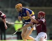14 April 2002; Lar Corbett of Tipperary in action against Declan O'Brien of Galway during the Allianz National Hurling League Quarter-Final match between Galway and Tipperary at Semple Stadium in Thurles, Tipperary. Photo by Brendan Moran/Sportsfile